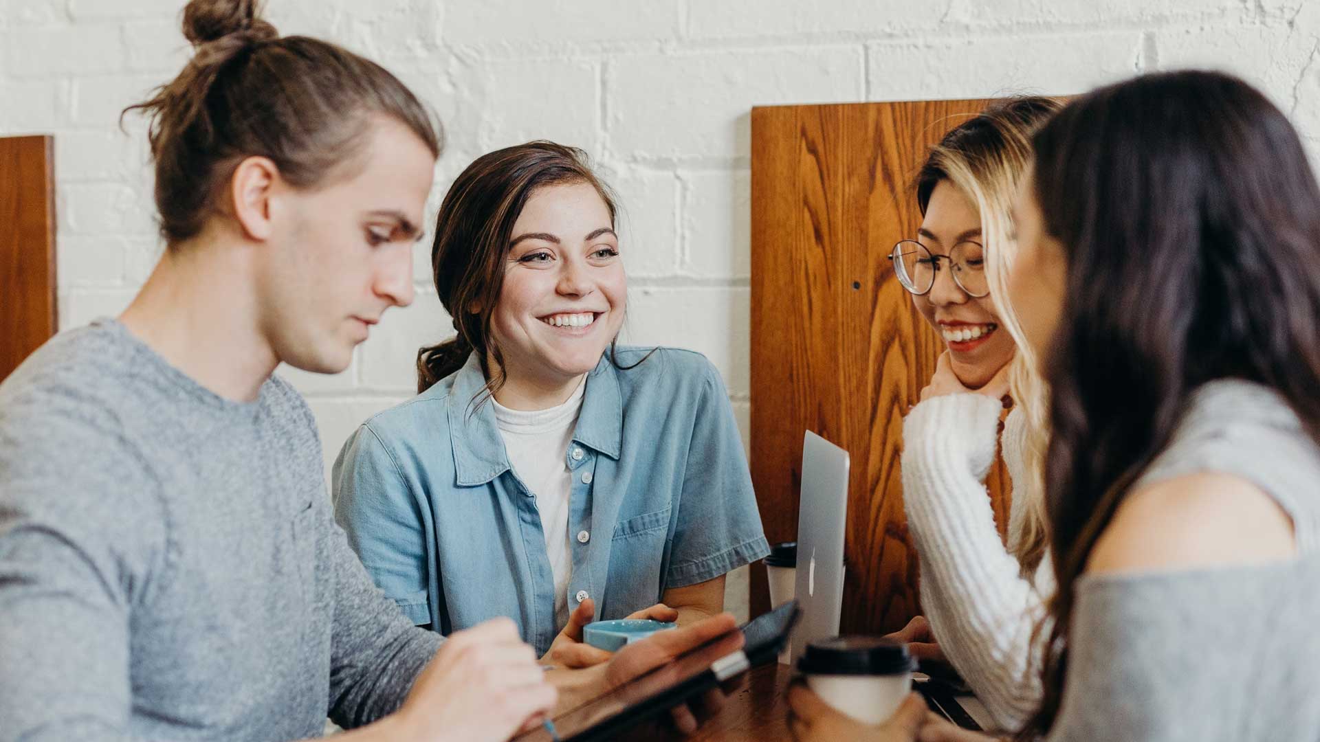 Students talking to each other and smiling