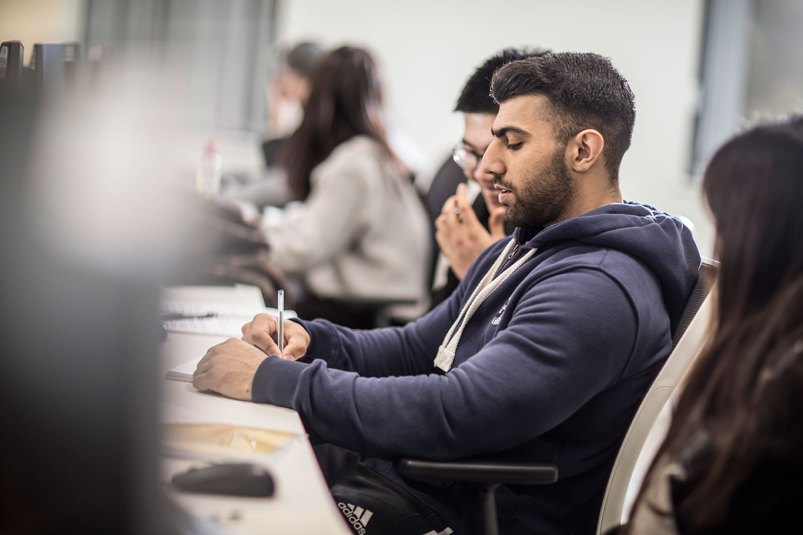 Business Economics students working together in a classroom