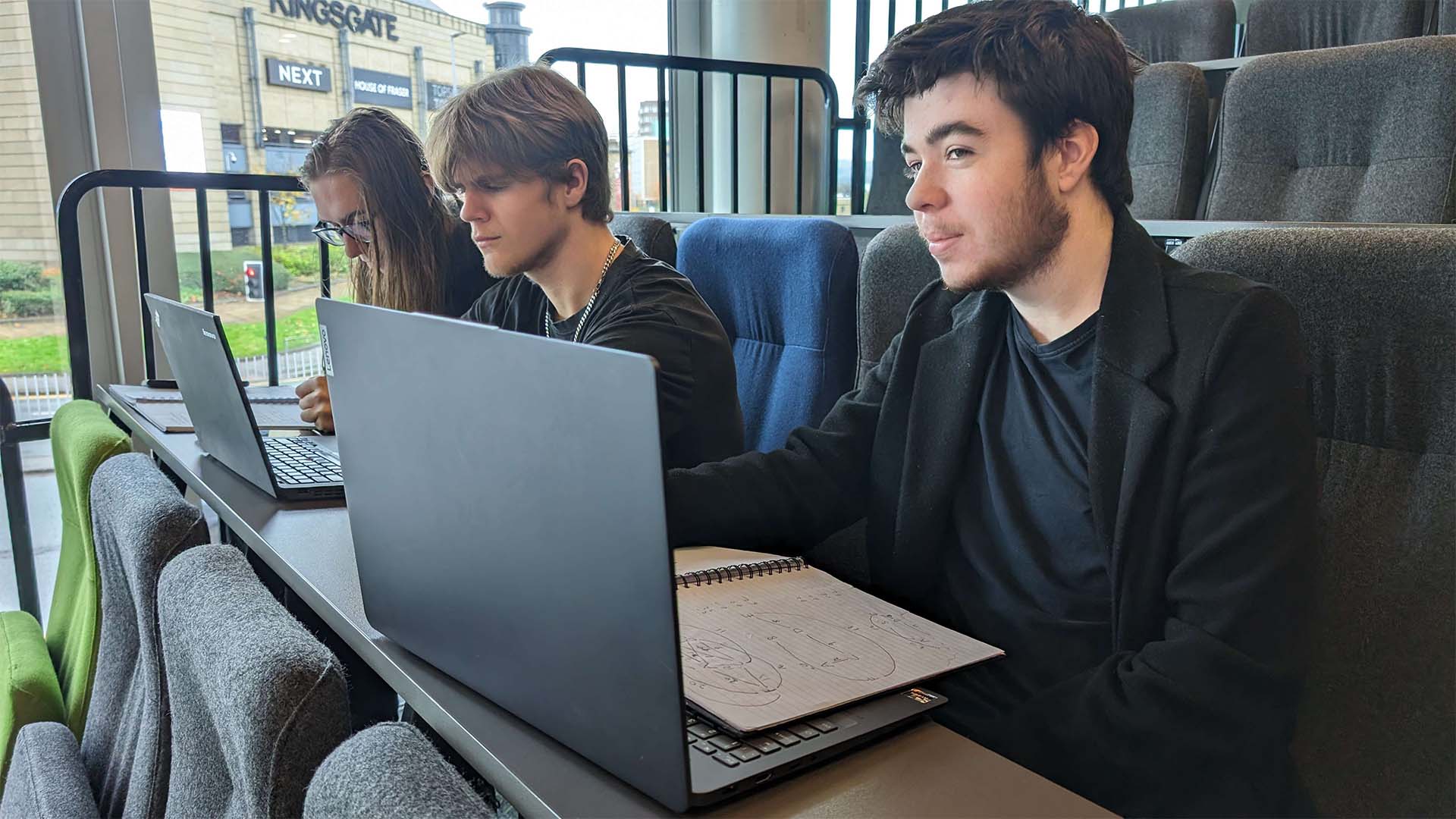 computer science student John Reid and friends in a lecture theatre