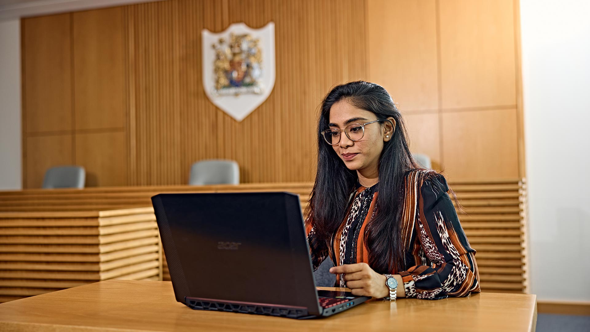 A student working on a laptop.