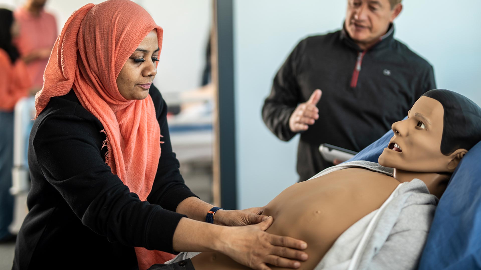 A student with a patient simulation mannequin.