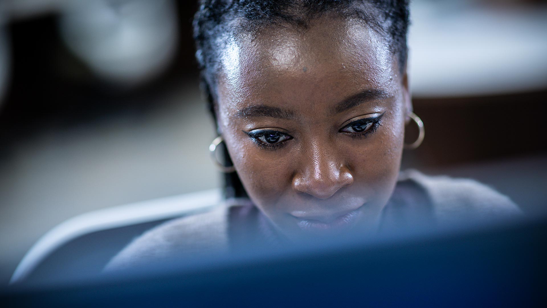 A closeup of a student looking at a computer screen.