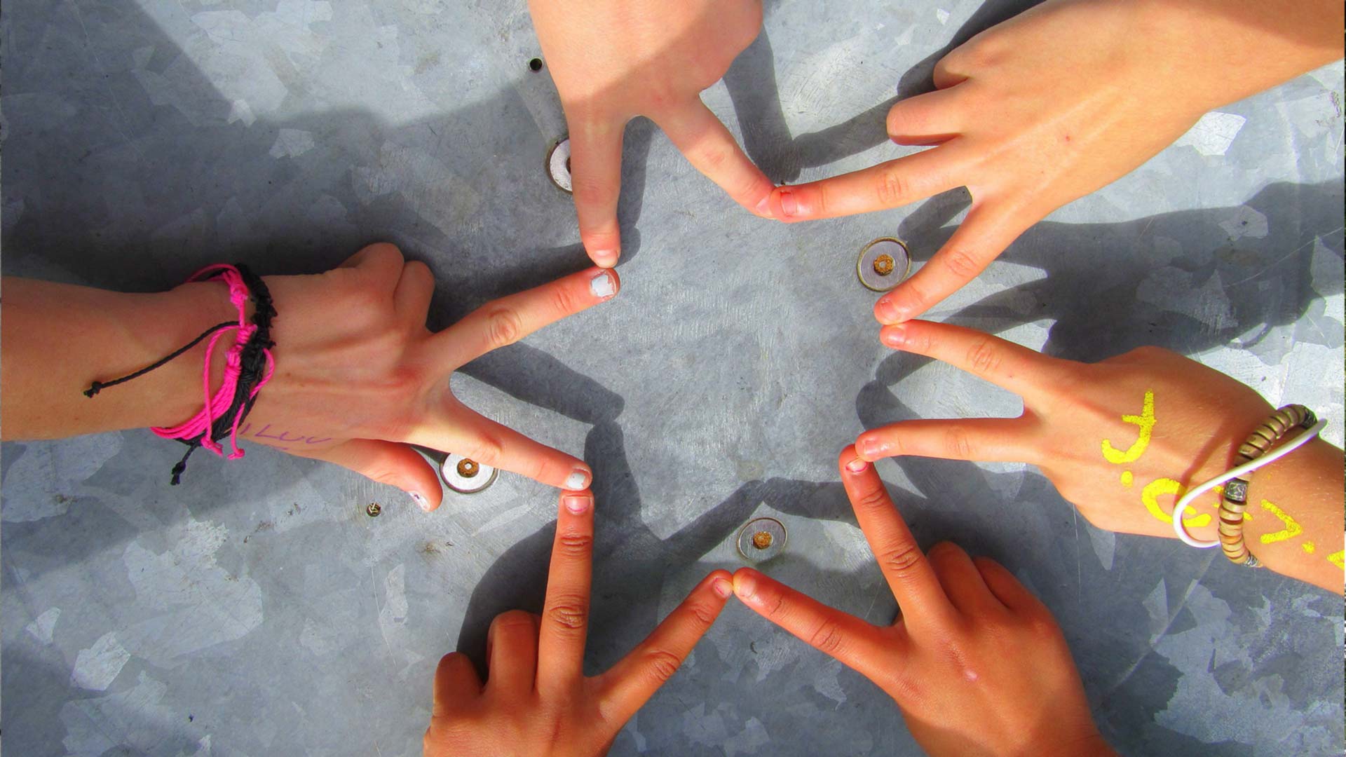 Children's fingers making a star shape