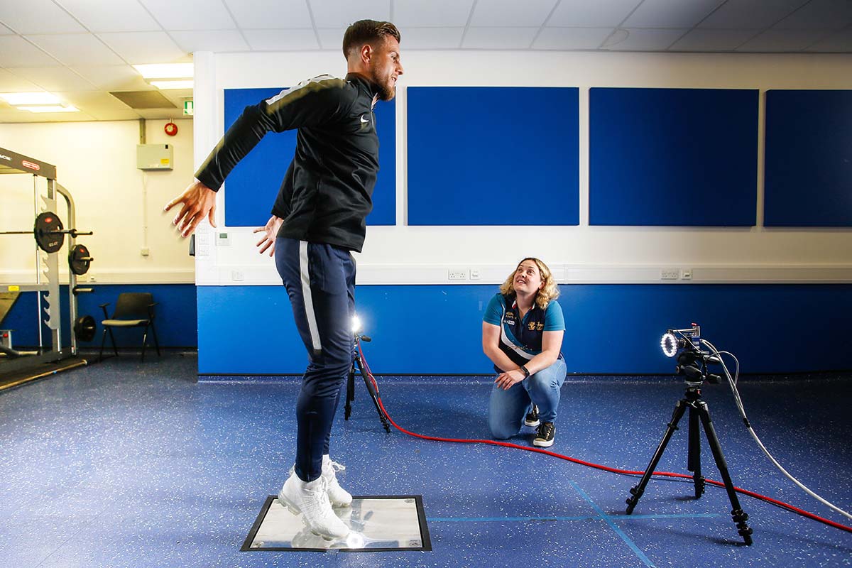 A Sport Science student jumping in the lab