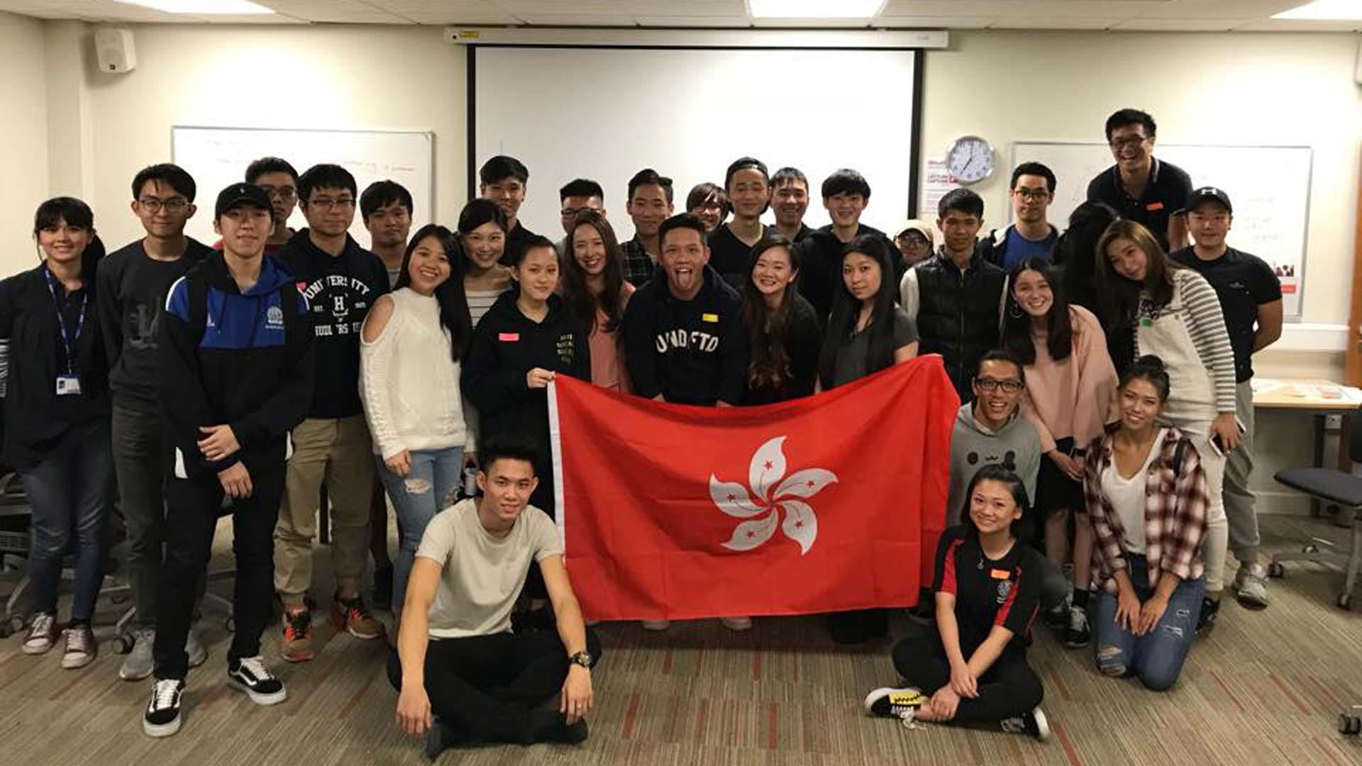 Group photo of Hong Kong Student Society with flag