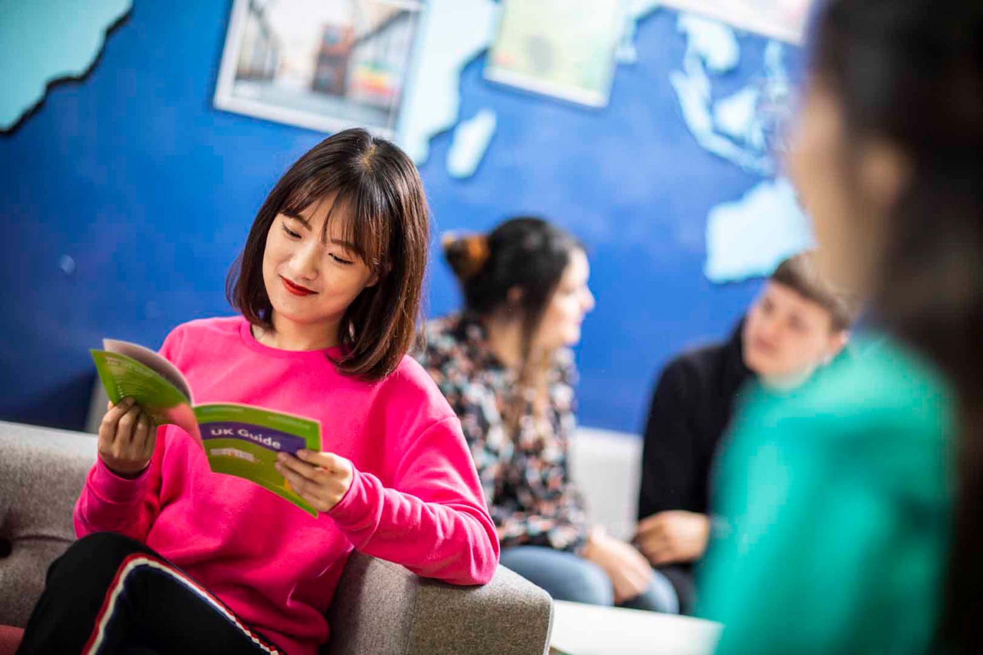 A student looking at a booklet about the UK