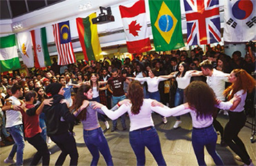 International students dancing at an Food and Culture Festival.