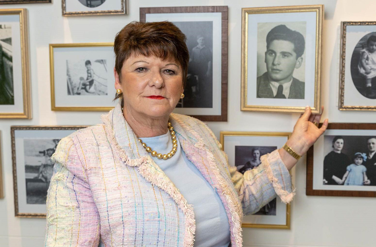 Chair of the Holocaust Survivors’ Friendship Association Lilian Black at the Holocaust Exhibition and Learning Centre with the photo of her father, Holocaust survivor Eugene Black.