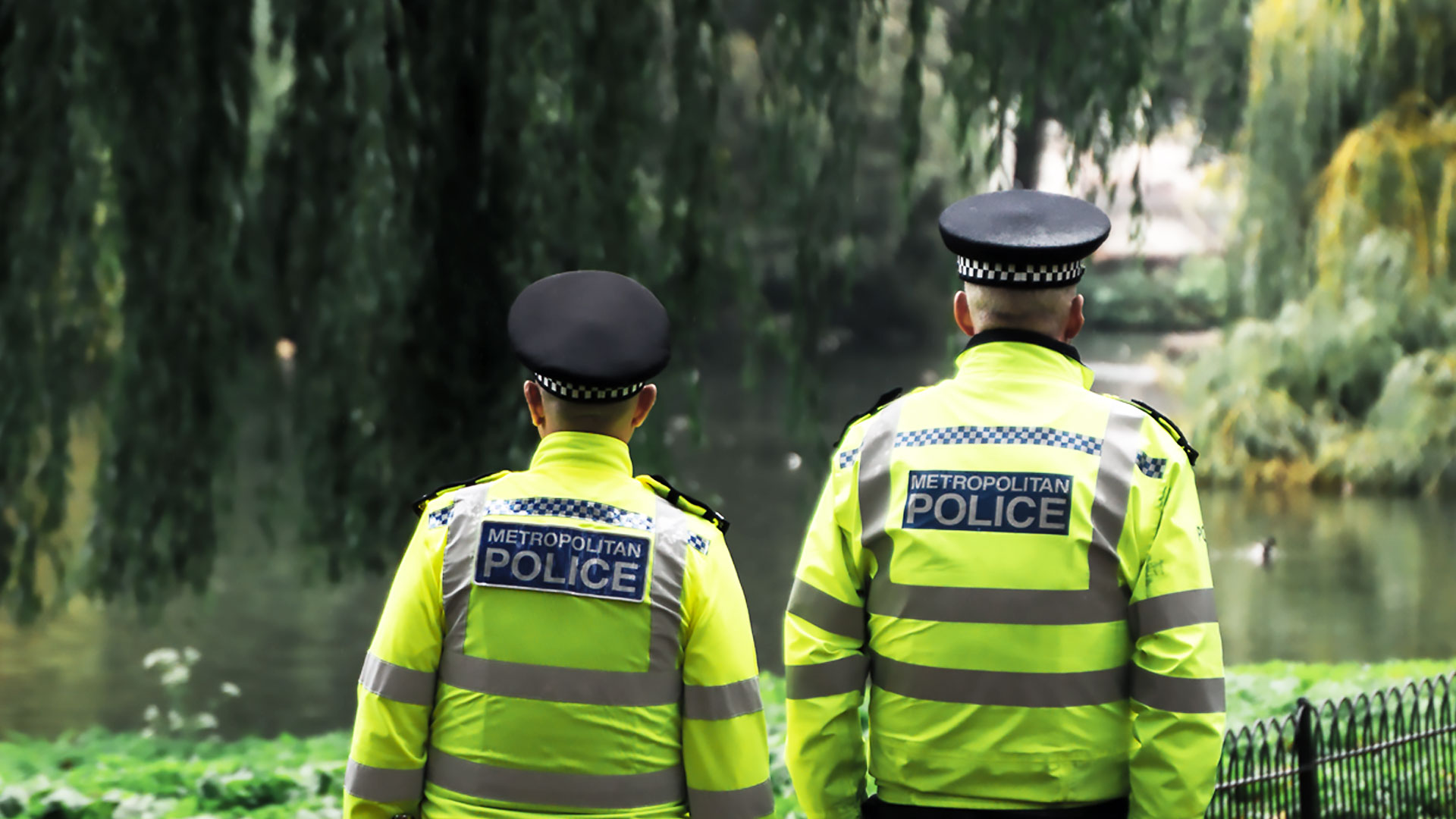 Two police officers walking next to each other