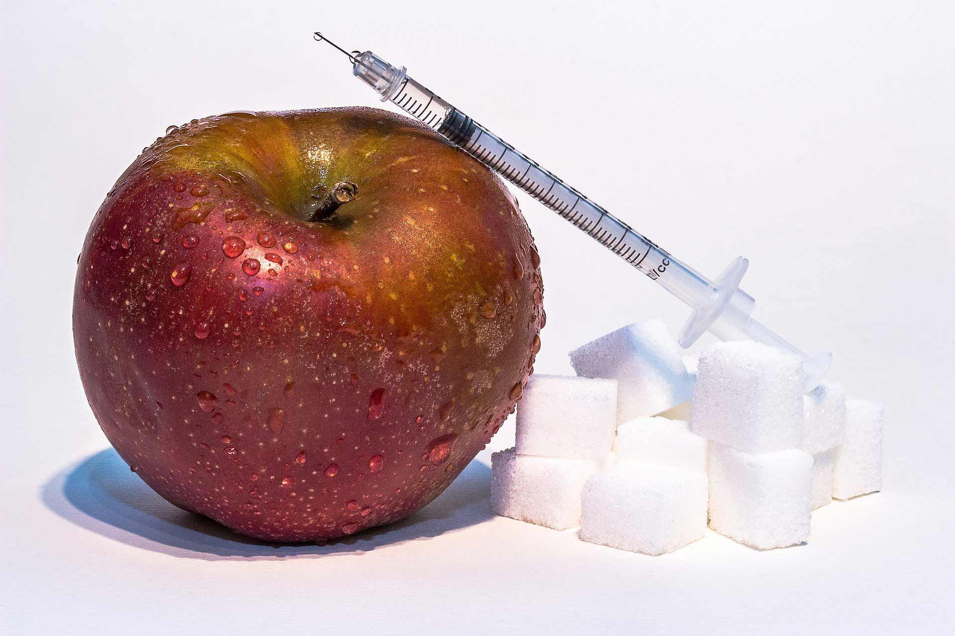 decorative image of apple, syringe and sugar