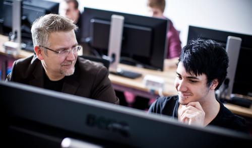 Teacher and student in a computer lab