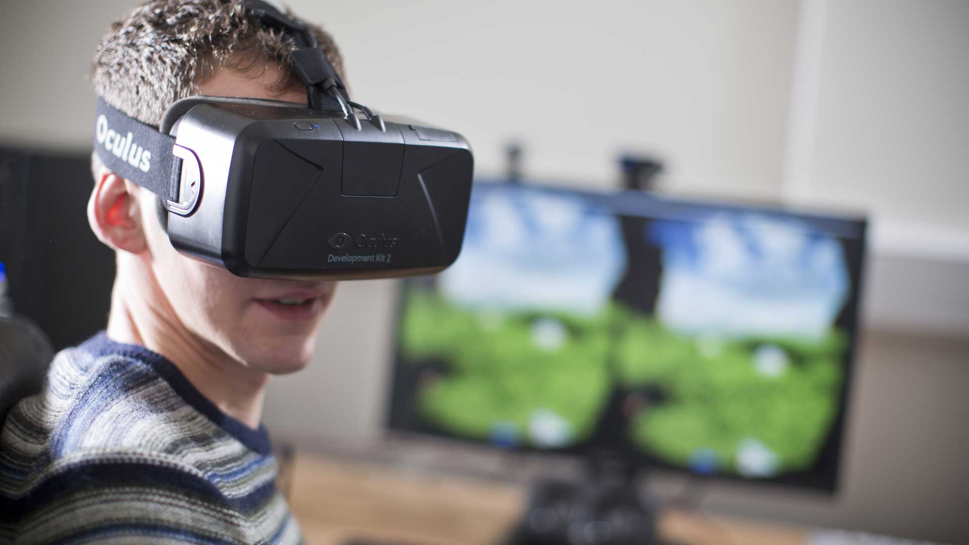 Student sat looking through a VR headset.