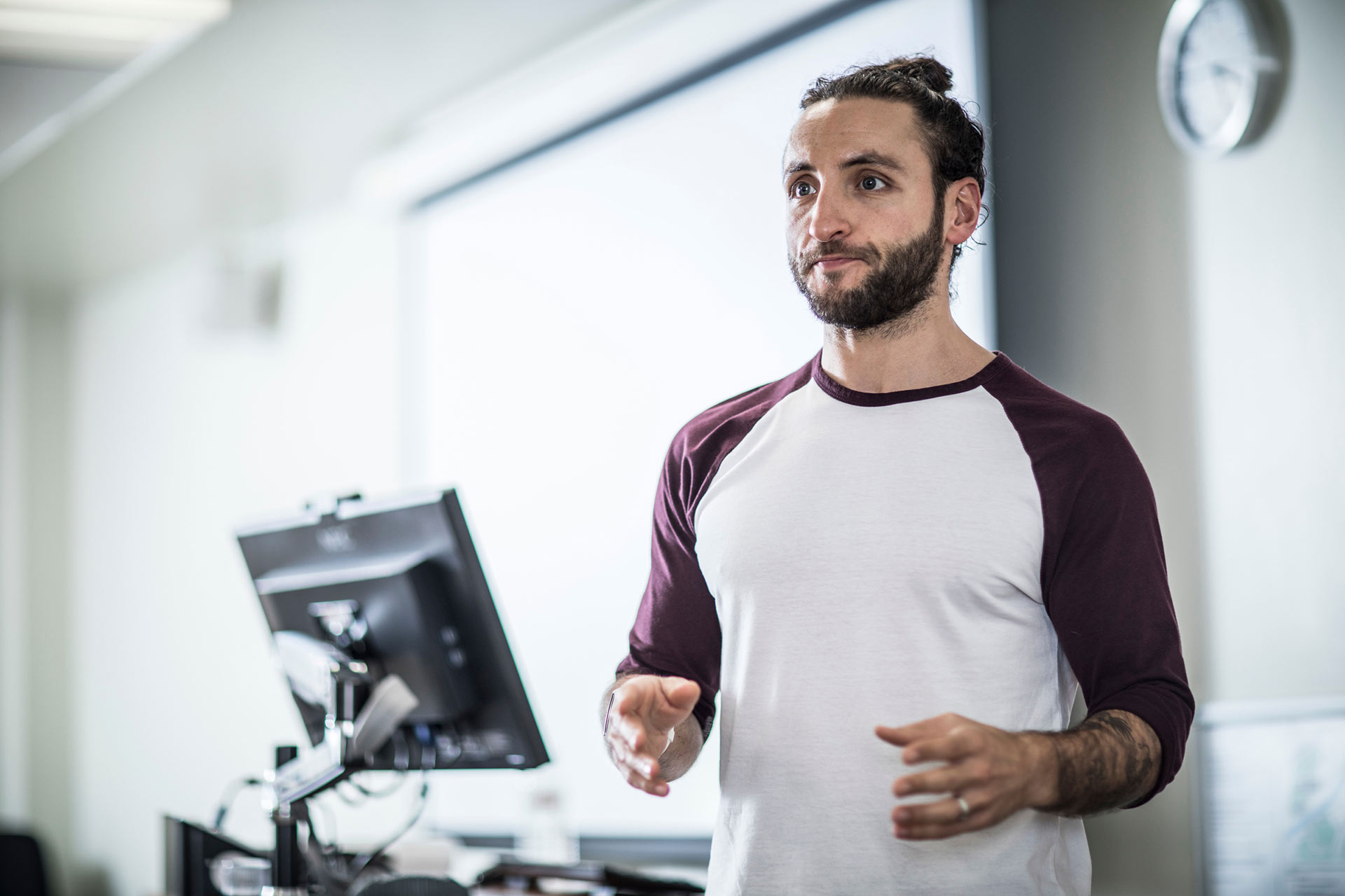 A teacher presenting at the front of a class