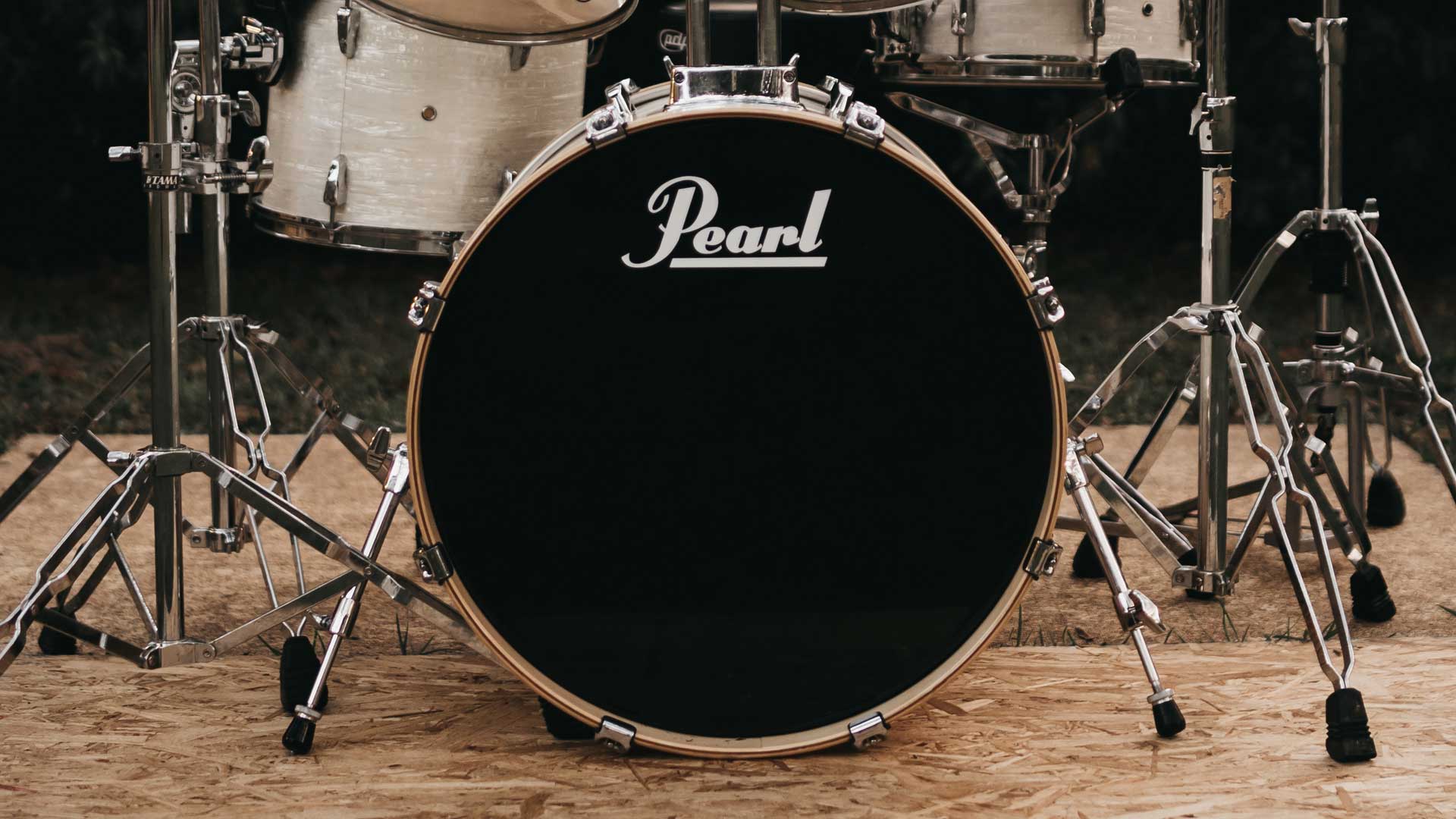 Photo focused on a Peal bass drum as part of a drum kit